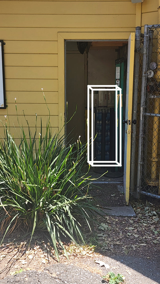 White safe outline overlaid on an open doorway