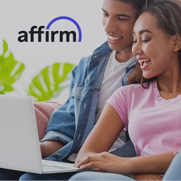 Two people using a laptop with the Affirm logo in the background
