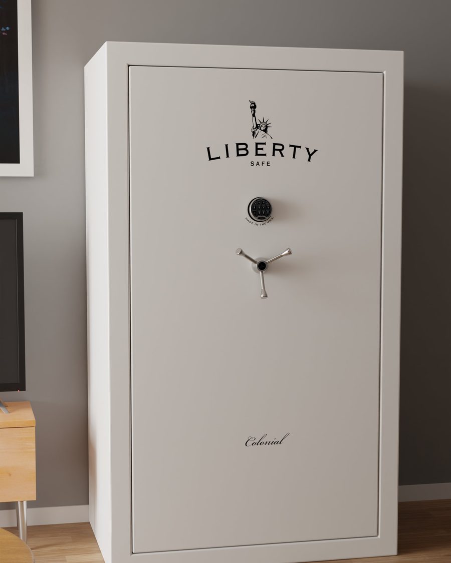 A white Liberty home safe standing in a living room, the one-time cost set against the compounding cost of going without one