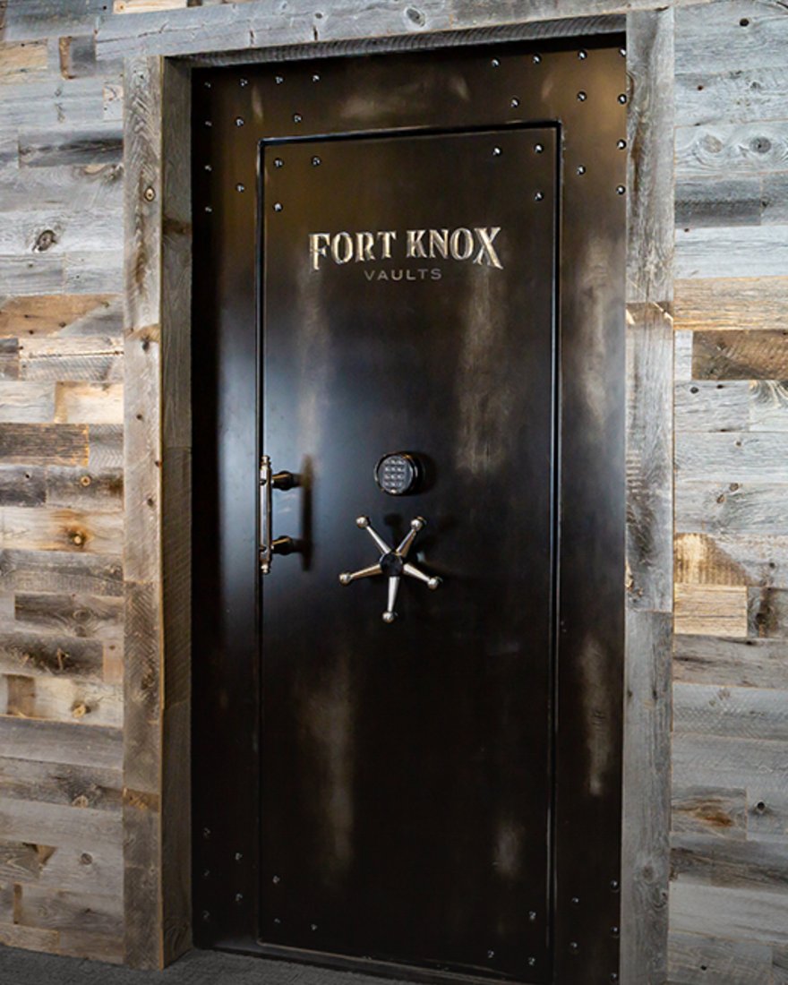 A Fort Knox commercial vault door framed in reclaimed wood in a finished Northern California interior