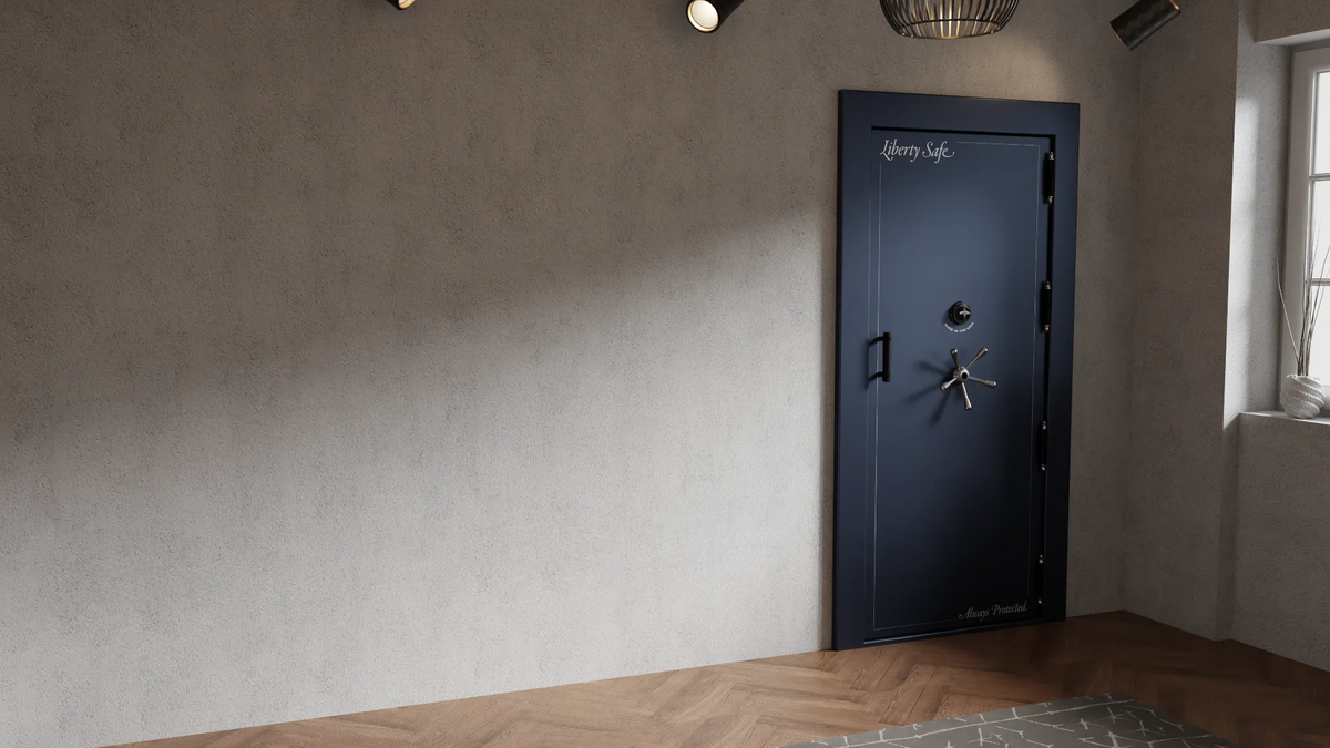 A navy blue Liberty vault door with a five-spoke handle set into the wall of a residential room