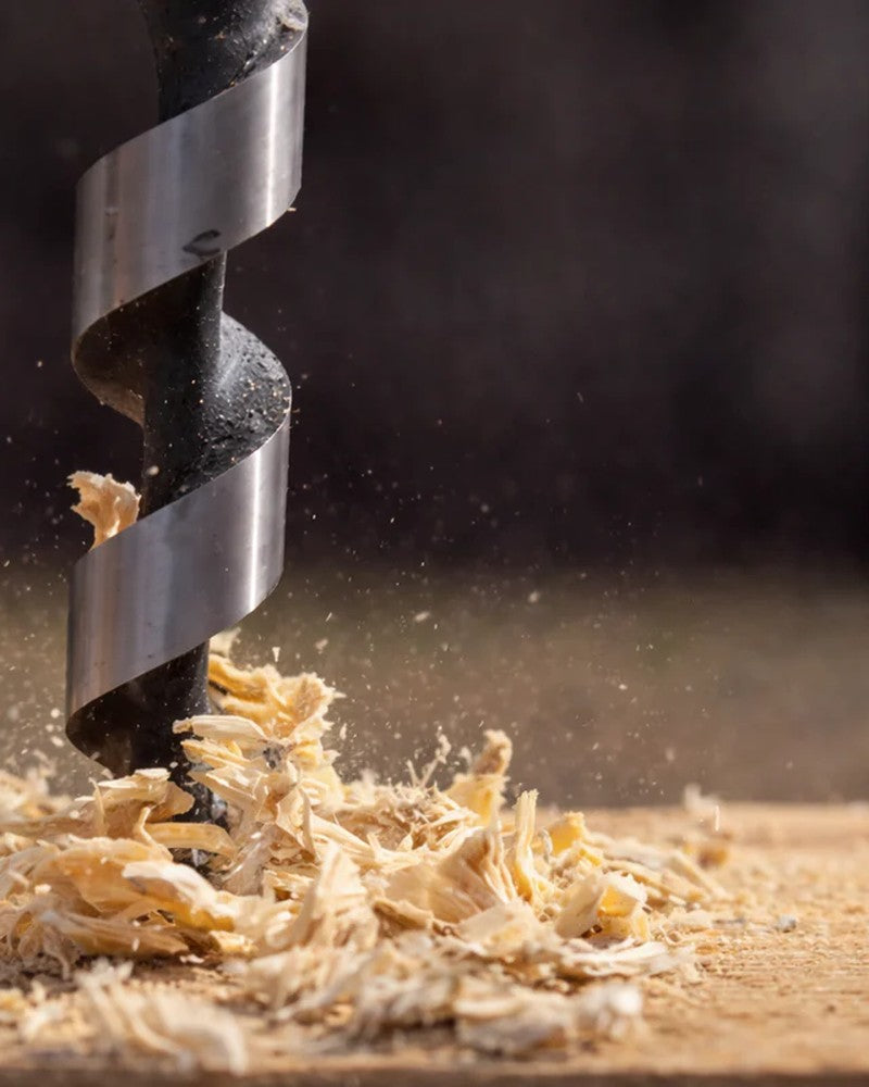 Drill bit boring into wood floor, safe anchor installation in a Northern California home